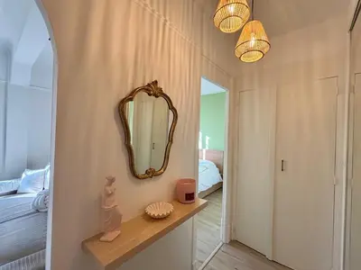 a room with a mirror on the wall next to a bedroom at Appartement cosy - 4 personnes - Centre Cannes in Cannes