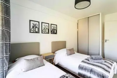 a bedroom with two beds and a mirror at Cannes 2 bedrooms apartment & 2 bathrooms - 160A in Cannes