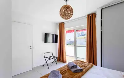 a bedroom with a bed and a window at Cannes 2 bedrooms apartment & 2 bathrooms - 160A in Cannes