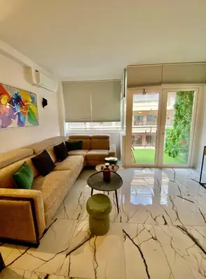 a living room with a couch and a table at Cannes 1 bedroom apartment - 20LM3 in Cannes