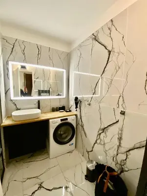 a bathroom with a washing machine and a mirror at Cannes 1 bedroom apartment - 20LM3 in Cannes