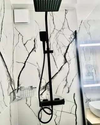a shower in a bathroom with a marble wall at Cannes 1 bedroom apartment - 20LM3 in Cannes