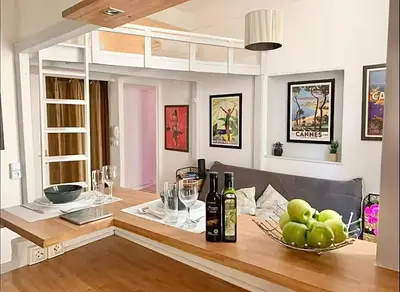 a dining room with a table with a bowl of apples at Cannes 1 bedroom apartment - 12RP1 in Cannes