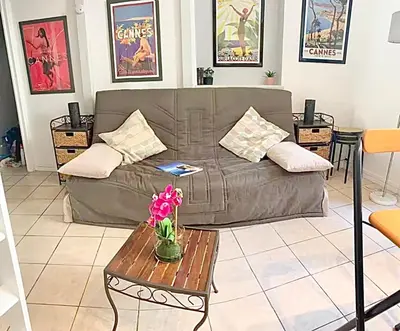 a living room with a couch and a table at Cannes 1 bedroom apartment - 12RP1 in Cannes