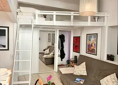 a living room with a bunk bed and a couch at Cannes 1 bedroom apartment - 12RP1 in Cannes