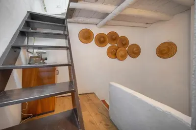a room with a ladder and donuts on the wall at MIPIM Fisherman House Rooftop Terrace Walk to Palais Suquet in Cannes