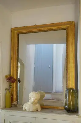 a mirror sitting on top of a shelf with a vase at MIPIM Fisherman House Rooftop Terrace Walk to Palais Suquet in Cannes
