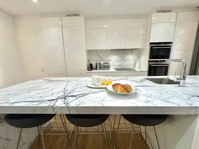 a kitchen with a counter with a plate of food on it at Atelier Meynadier in Cannes