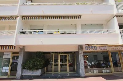 a building with a balcony on top of it at Spacious 2-Bedroom Apartment with Terrace Prime Location in Cannes in Cannes