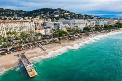 an aerial view of a beach with a pier at Spacious 2-Bedroom Apartment with Terrace Prime Location in Cannes in Cannes