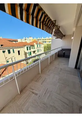 a balcony with a view of a building at Spacious 2-Bedroom Apartment with Terrace Prime Location in Cannes in Cannes