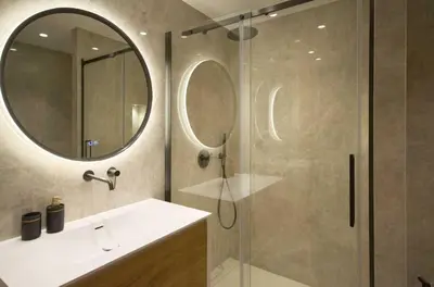 a bathroom with a shower and a sink and a mirror at A C apt in the heart of Cannes—Croisette Beaches in Cannes