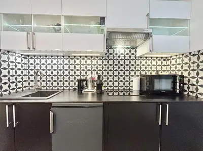 a kitchen with a sink and a microwave at Cannes 1 bedroom apartment - 57A2 in Cannes