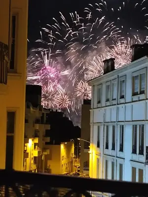 a firework display in the sky over a building at Cannes centre superbe 3 pièces moderne 10 min à pied du Palais des festivals et croisette in Cannes