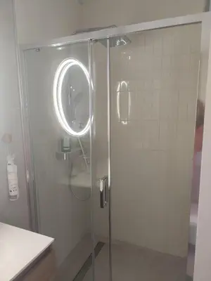 a shower with a glass door in a bathroom at Cannes centre superbe 3 pièces moderne 10 min à pied du Palais des festivals et croisette in Cannes