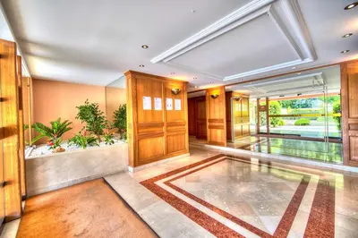 a large hallway with a lobby with plants in it at Beautiful 36m2 studio apartment & 50m2 terrace in Cannes