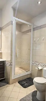 a bathroom with a shower with a toilet in it at Beautiful 36m2 studio apartment & 50m2 terrace in Cannes