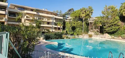 a swimming pool in front of a apartment building at Beautiful 36m2 studio apartment & 50m2 terrace in Cannes
