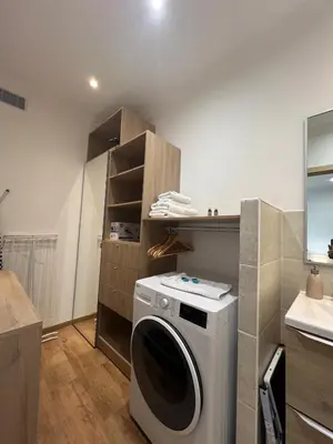 a kitchen with a washing machine in a room at King size studio Rue Félix Faure 100 m Palais et plage in Cannes