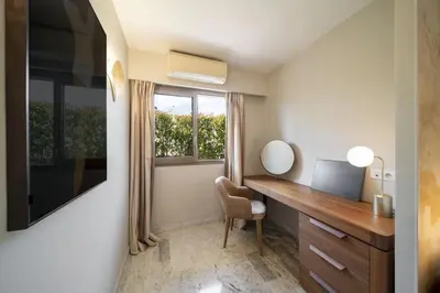 a home office with a desk and a mirror at -CLR- Stunning suite with terrace in Cannes