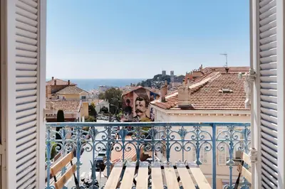 a view of a city from a balcony at BnGo l Ruby Suite l 2ch, 7p, vue mer, centre in Cannes