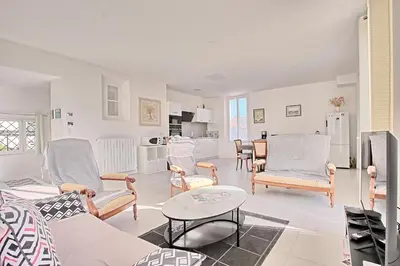 a living room with a couch and chairs and a table at Villa Grand Jas in Cannes