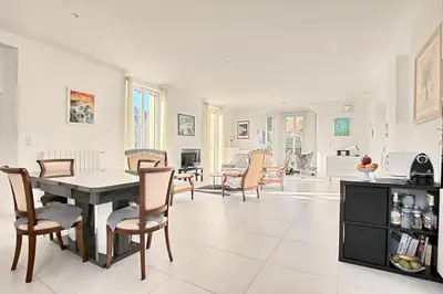 a kitchen and dining room with a table and chairs at Villa Grand Jas in Cannes