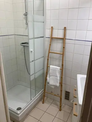 a shower with a glass door in a bathroom at Grand studio pointe croisette in Cannes