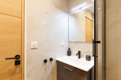 a bathroom with a sink and a shower at Santa Cruz YourHostHelper in Cannes