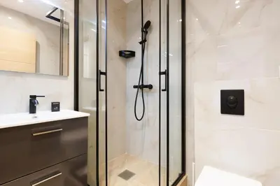 a shower with a glass door in a bathroom at Santa Cruz YourHostHelper in Cannes