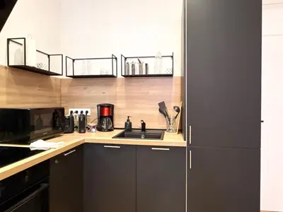 a kitchen with a sink and a microwave at Le Palme d'Or, 3 pièces - impasse privée - 7 pers in Cannes