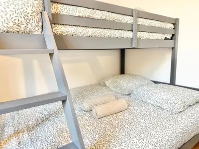 a bunk bed in a bedroom with a bunk bedutenewayewayangering at Le Palme d'Or, 3 pièces - impasse privée - 7 pers in Cannes