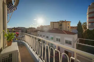 a balcony with a view of a city at Mimosa 2BR with Balcony - Walk to Palais and Beach in Cannes