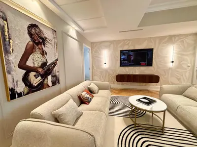 a living room with a couch and a table at SCARLETT 4 Bedroom next to the Croisette in Cannes