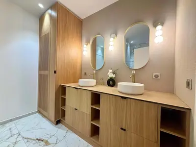 a bedroom with a bed and a chair and a window at SCARLETT 4 Bedroom next to the Croisette in Cannes