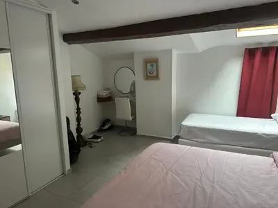 a living room with a fireplace and a microwave at Cannes centre ville en face du port in Cannes