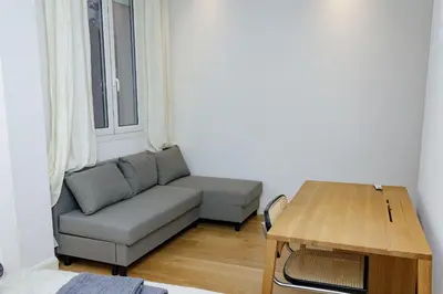 a living room with a couch and a table at Palais Riviera in Cannes