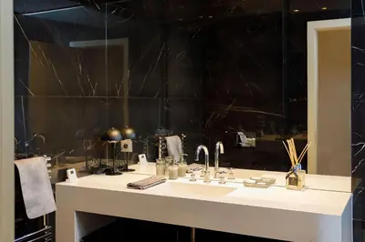 a bathroom with a white sink and a mirror at Palais Riviera in Cannes