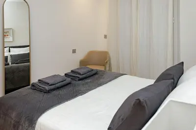 a bedroom with a bed with two towels on it at Palais Riviera in Cannes