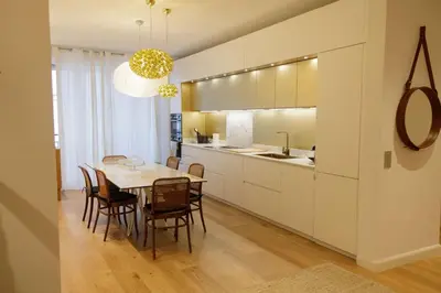 a kitchen and dining room with a table and chairs at Palais Riviera in Cannes