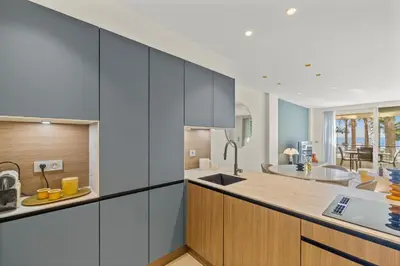 a kitchen with a sink and a counter top at REF 2032 Renovated apartment-Sea view -Ideal for conferences and vacations in Cannes