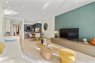 a living room with a large flat screen tv at REF 2032 Renovated apartment-Sea view -Ideal for conferences and vacations in Cannes