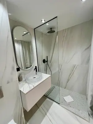 a bathroom with a sink and a mirror at T2 chic et moderne à deux pas de la Croisette in Cannes