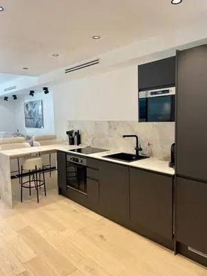 a kitchen with a sink and a counter at T2 chic et moderne à deux pas de la Croisette in Cannes