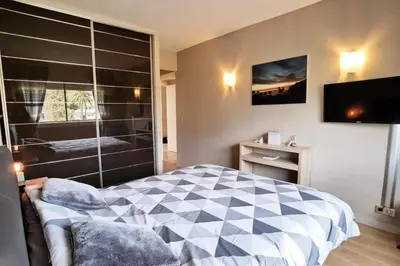 a bedroom with a large bed and a television at Résidence 4p Terrasse & Vue Mer, Plage à 5 Min - 4P terrasse & vue mer, plage à 5 min MAE-1563 in Cannes
