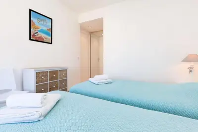two beds sitting next to each other in a bedroom at Résidence 3p De Standing, Vue Mer Et Grande Terrasse - 3P de standing, vue mer et grande terrasse MAE-1613 in Cannes