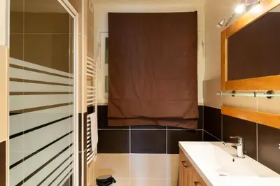 a bathroom with a sink and a toilet and a window at Résidence 3p à 2 Min De La Rue D’antibes Et Des Plages - 3P à 2 min de la rue d’Antibes et des Plages MAE-1623 in Cannes