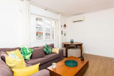 a living room with a couch and a table at Résidence 3p à 2 Min De La Rue D’antibes Et Des Plages - 3P à 2 min de la rue d’Antibes et des Plages MAE-1623 in Cannes