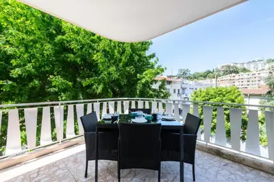 a table and chairs on a balcony with a view at Résidence 3p Cosy, 6 Minutes à Pied Des Plages - 3P cosy, 6 minutes à pied des plages MAE-1633 in Cannes