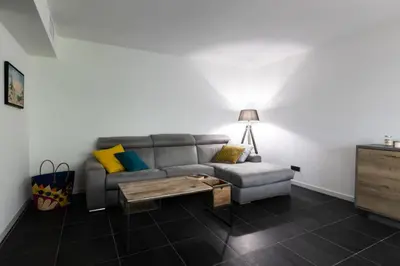 a living room with a couch and a coffee table at Résidence 3p Avec Jardin Et Piscine Au Coeur Du Palm Beach - 3P avec jardin et piscine au coeur du Palm Beach MAE-1643 in Cannes